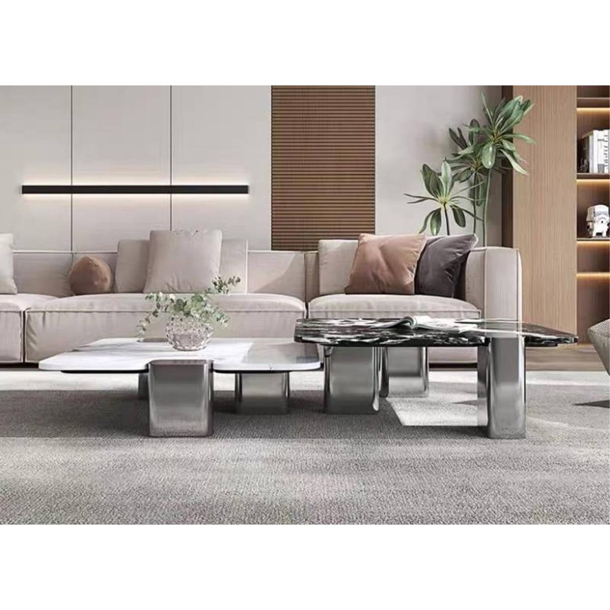 Side view of the marble coffee tables showing the stainless steel legs and height difference