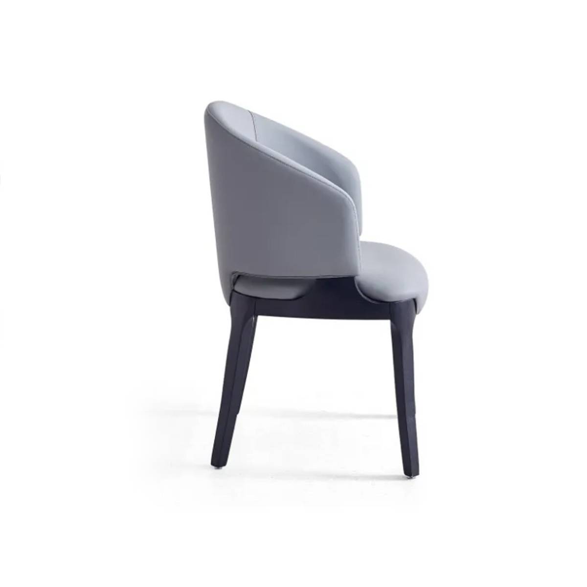 Side view of a grey modern dining chair showing the curved backrest
