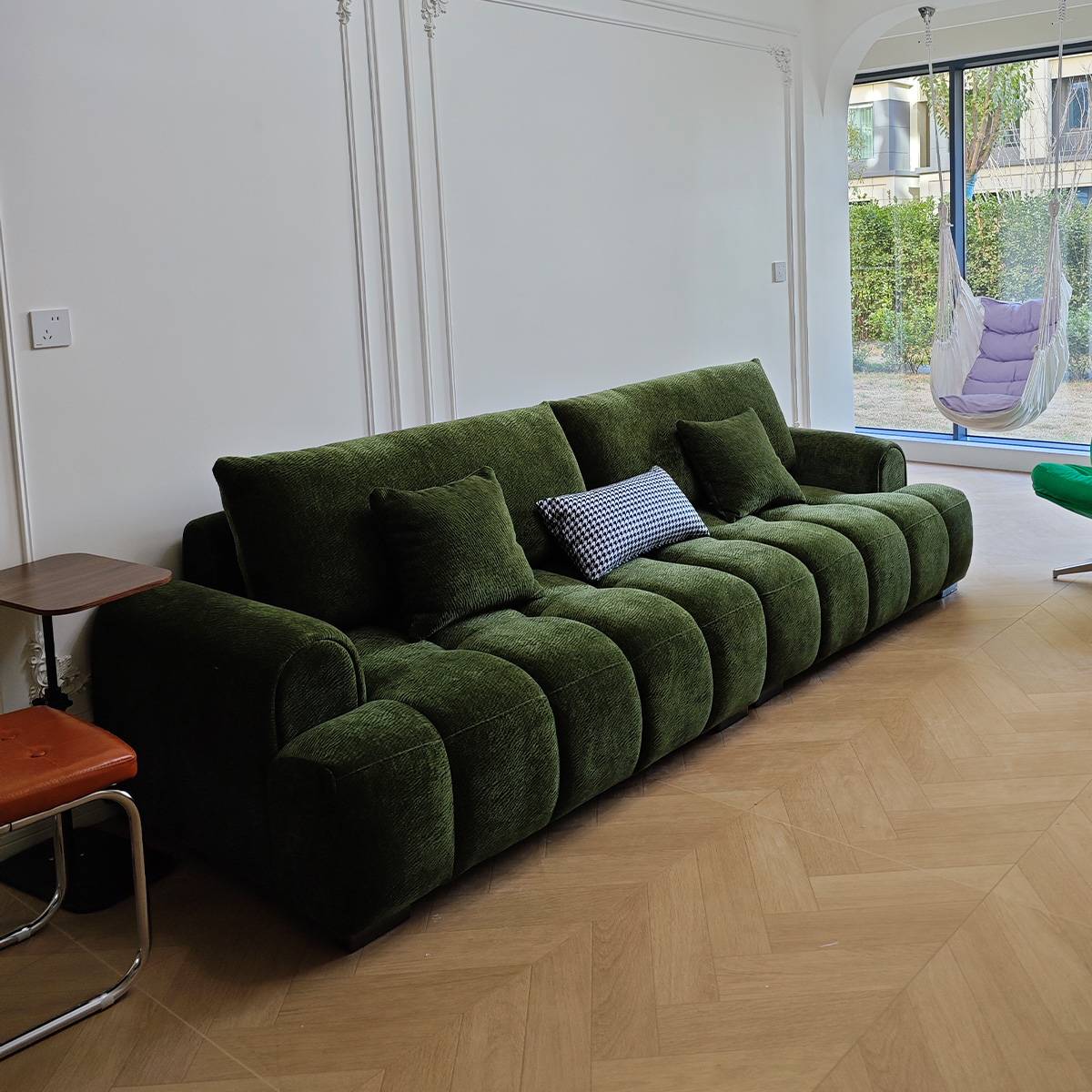 Green A72 Little Puff sofa in a living room setting with herringbone floor