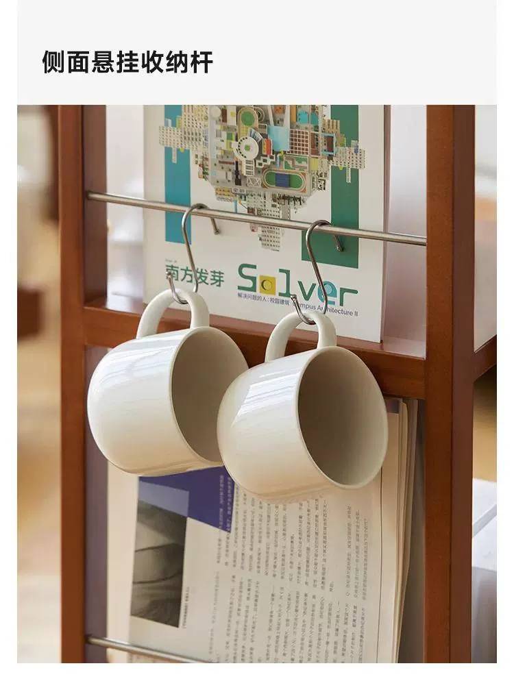 Side hanging storage rod holding two white mugs