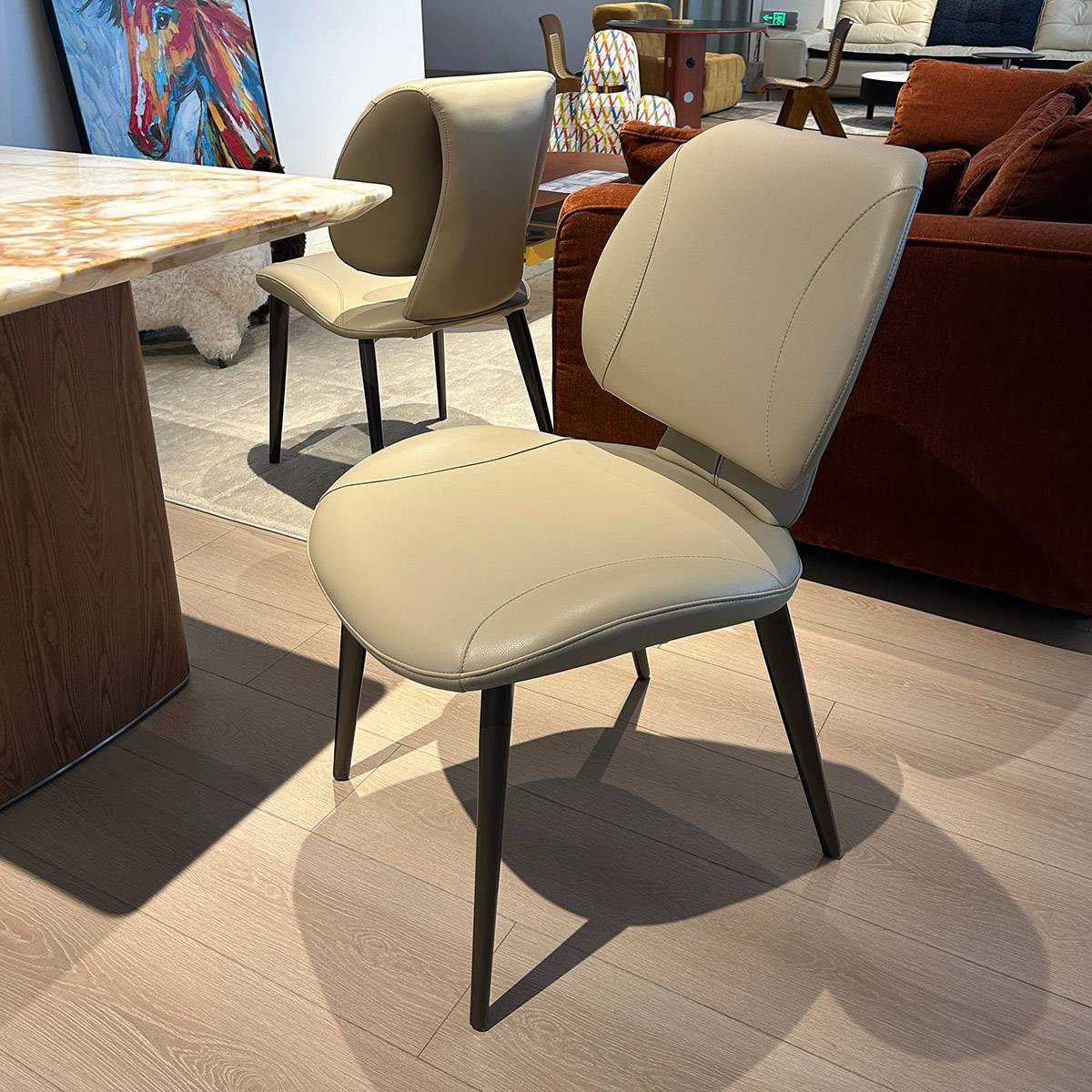 Beige dining chair placed next to a dining table