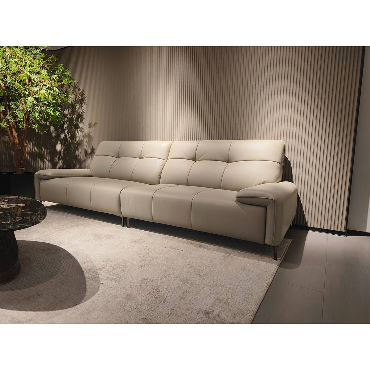 Side view of the beige leather sofa