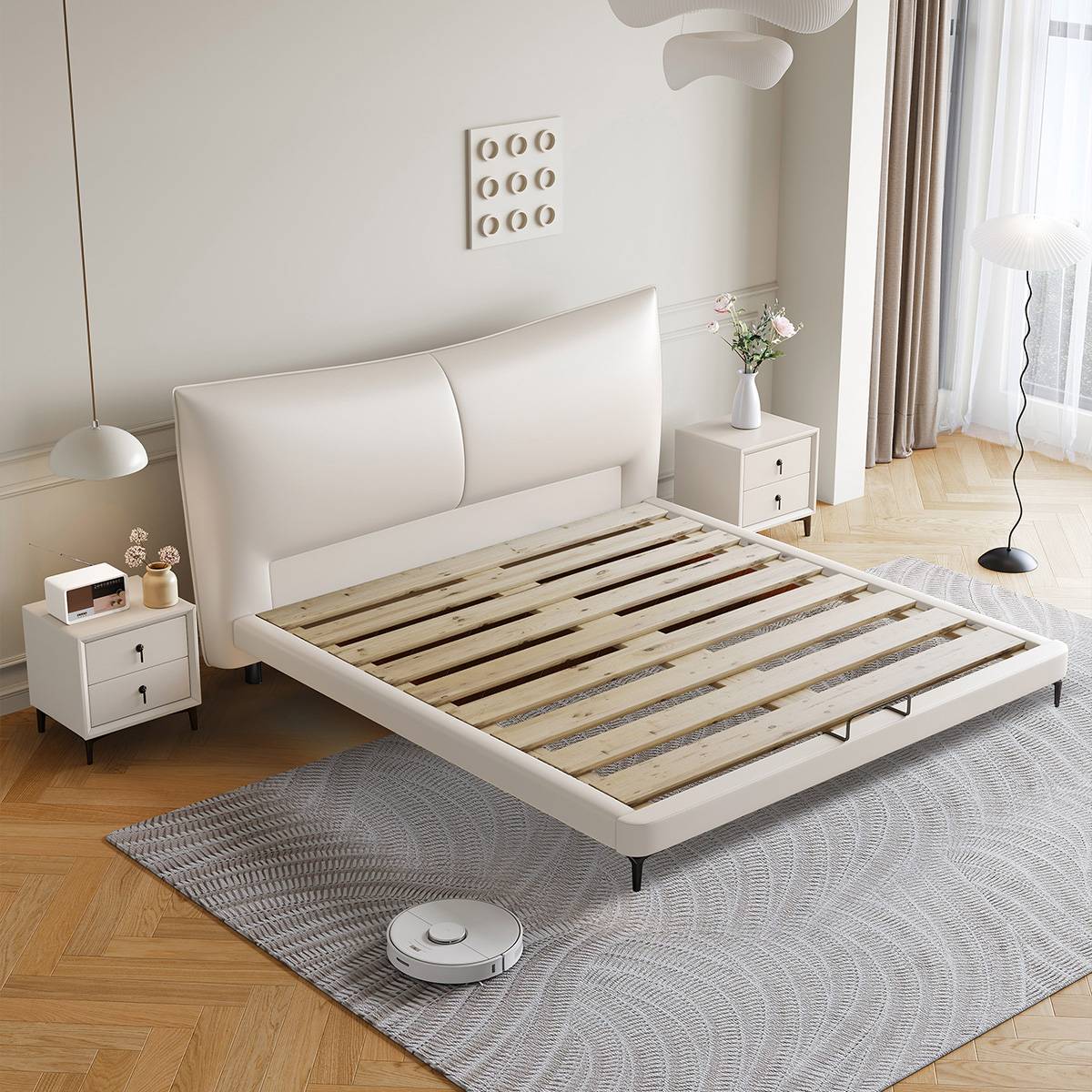 Bed frame showing the wooden slat base and metal legs without mattress