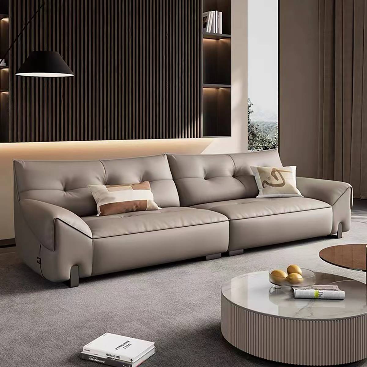 Side angle view of the beige leather sofa highlighting the armrest design