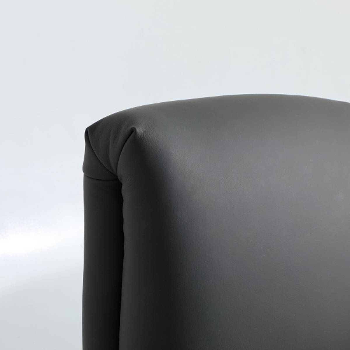 Close-up detail of the grey leather corner of the bed frame