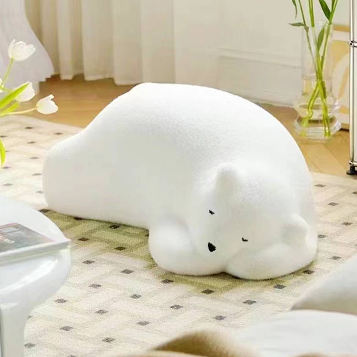 Close-up of the white bear stool on a patterned rug