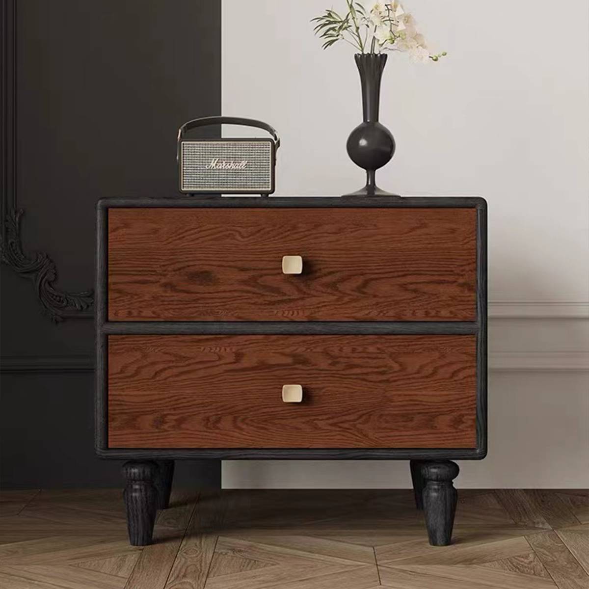 Close-up view of the bedside table drawers and handles