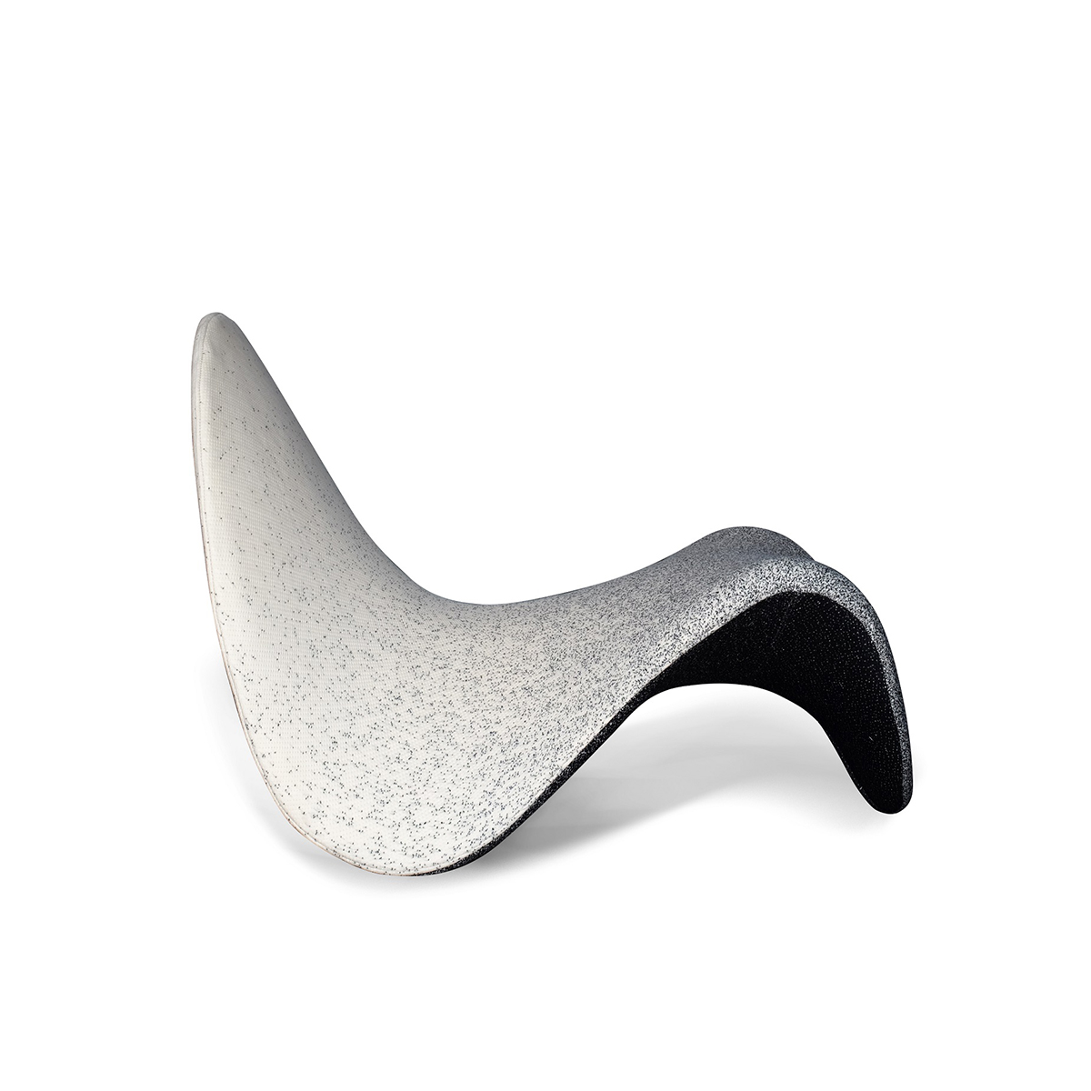 Profile view of the Tongue Chair highlighting the curved shape