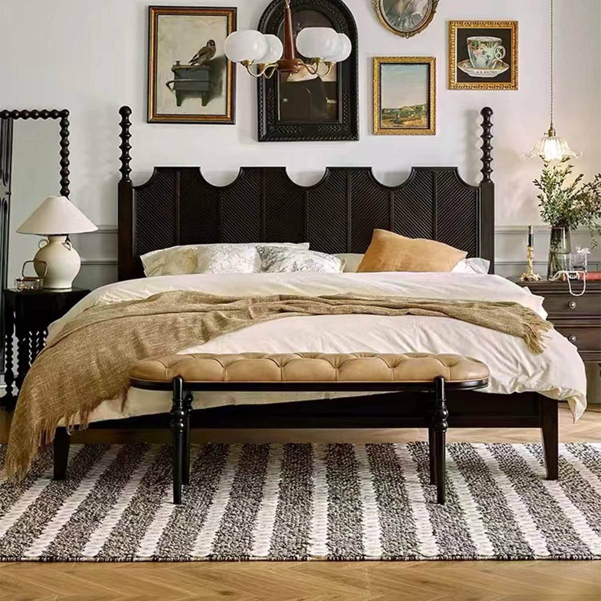 Full view of the minimalist black solid wood bed with a bench at the foot.