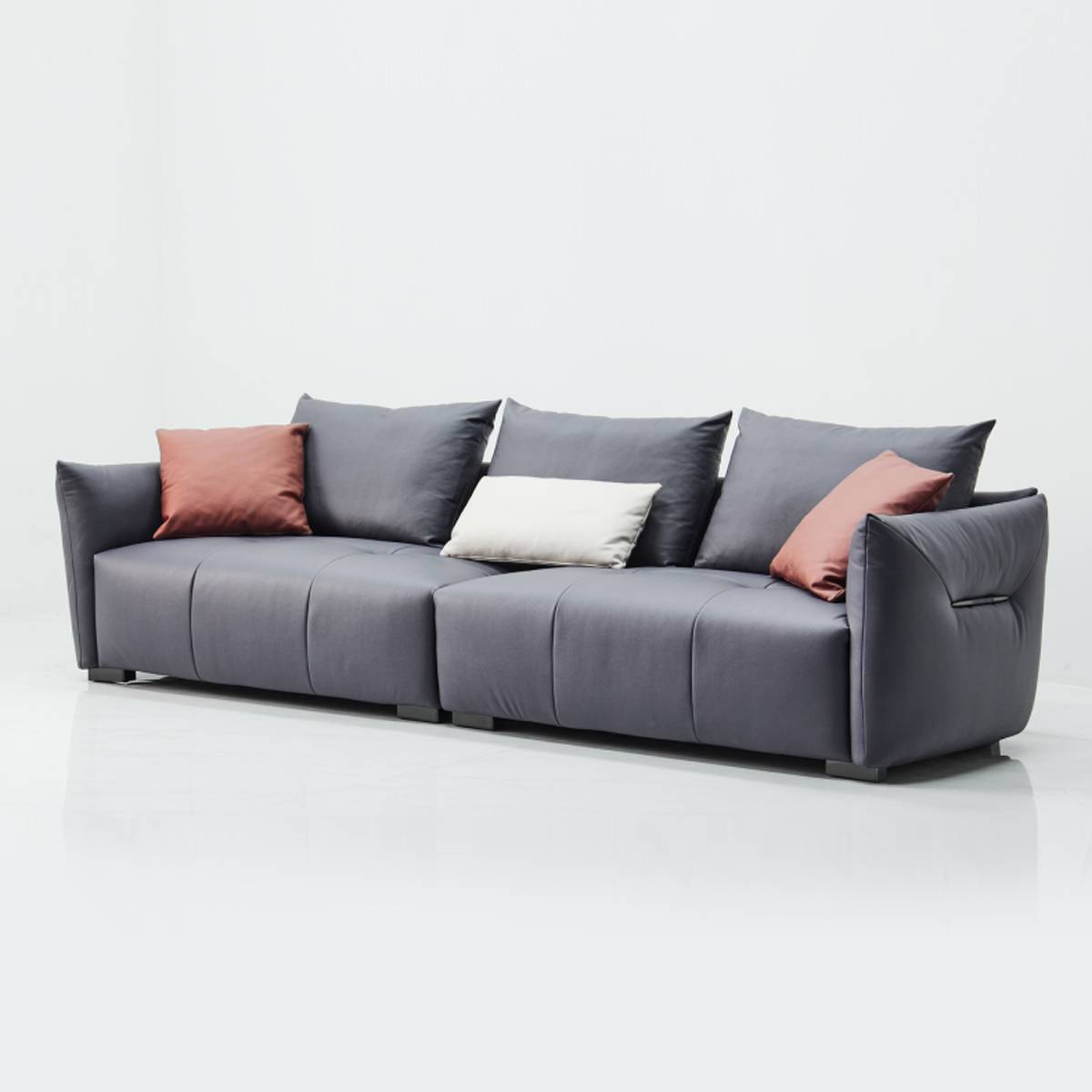 Front view of grey 4-seater straight sofa with decorative pillows