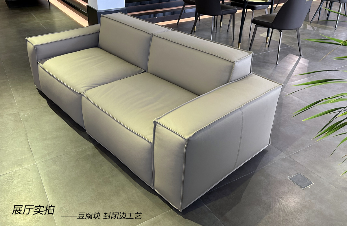Side angle view of the sofa showing the backrest and armrest structure