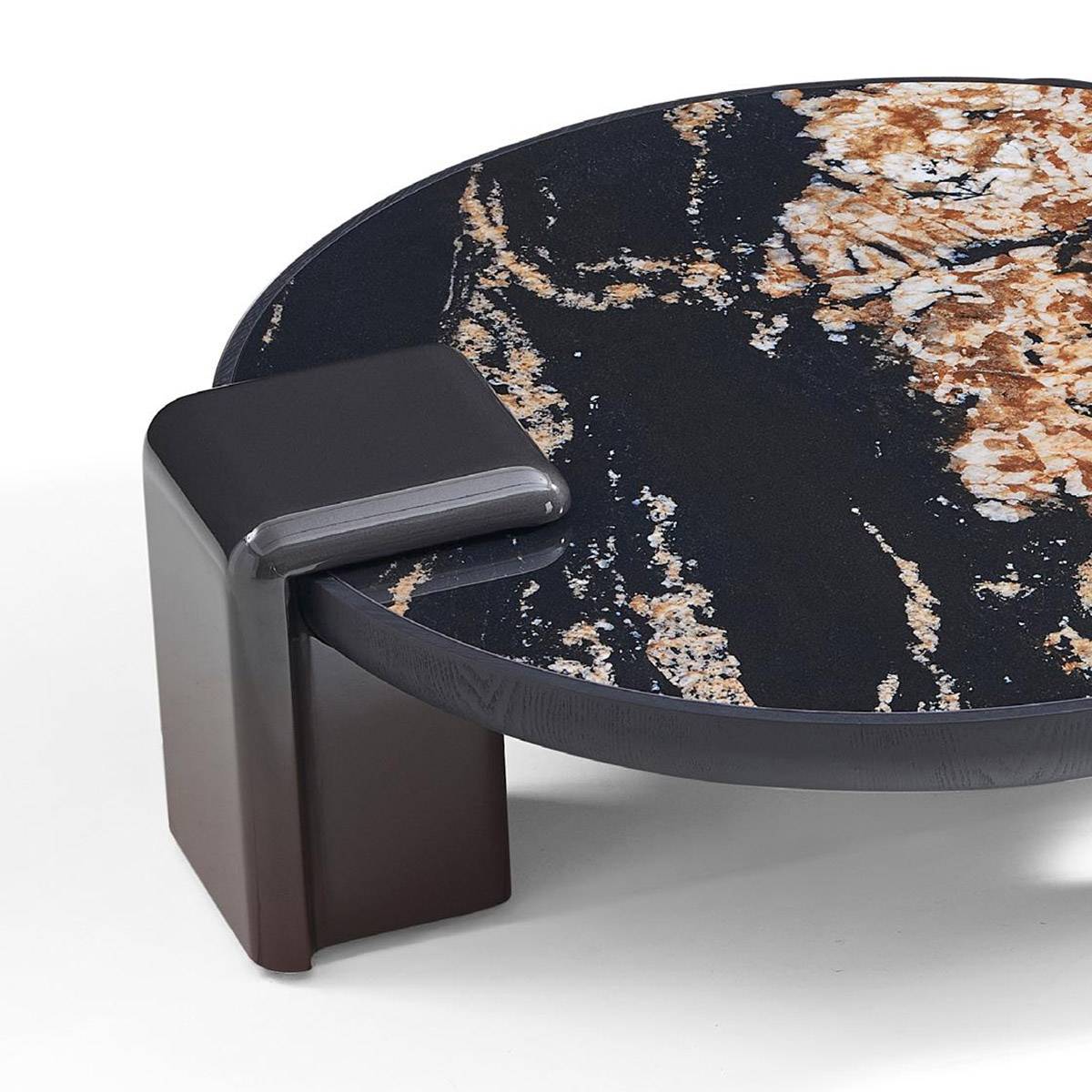 Close-up detail of the large coffee table showing the Pandora sintered stone texture and the gradient painted base.