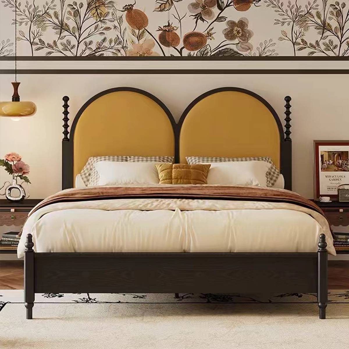 Close-up of the black turned wooden post and mustard velvet headboard