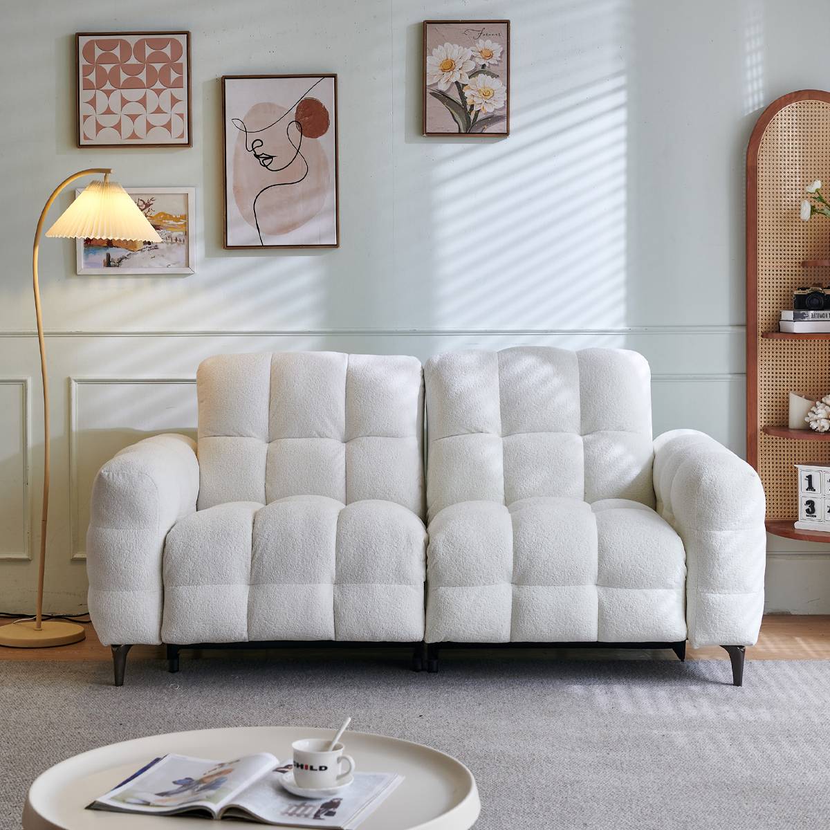 Front view of the white tufted sofa showing the plush texture and design