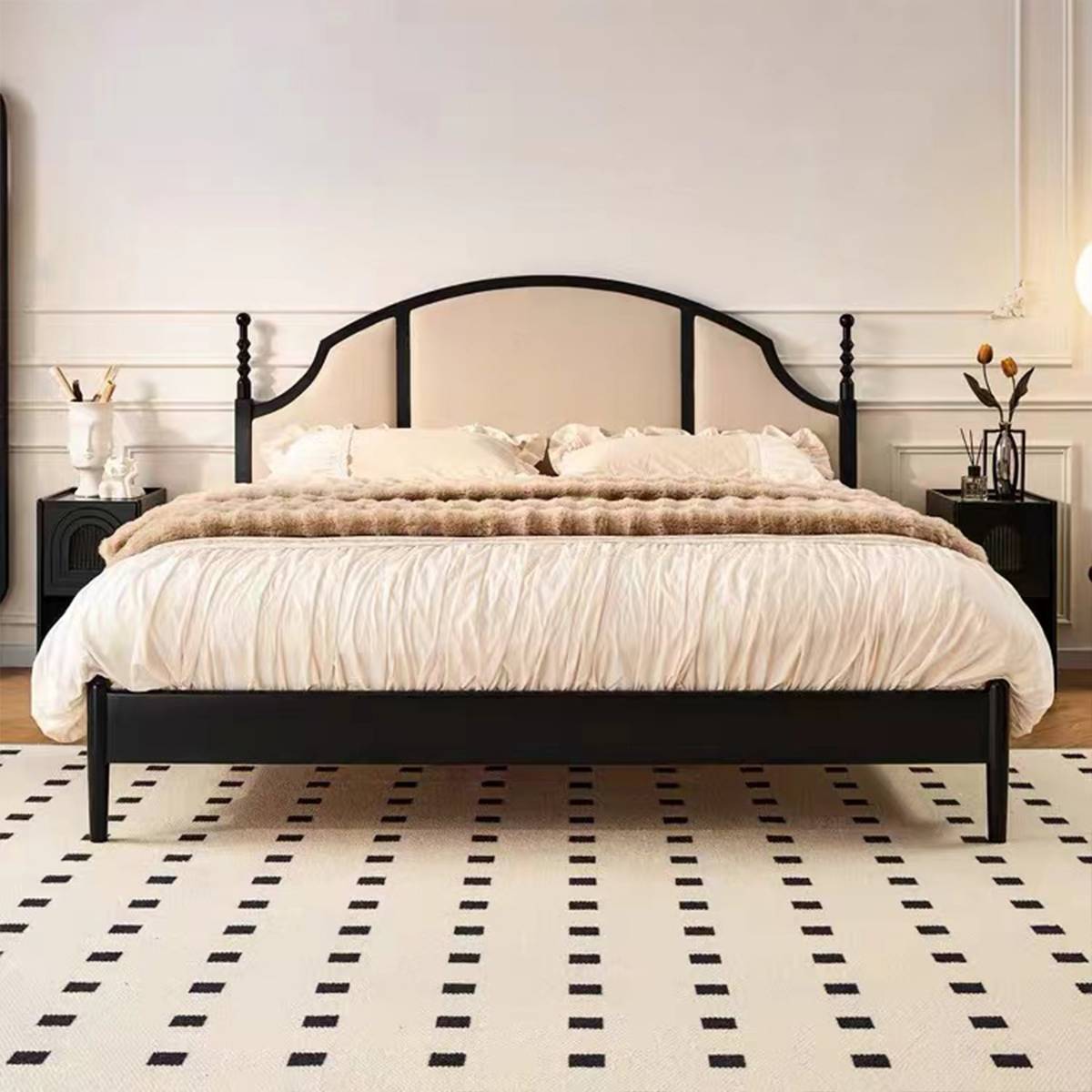Direct front view of the bed highlighting the symmetry of the headboard and the black finish.