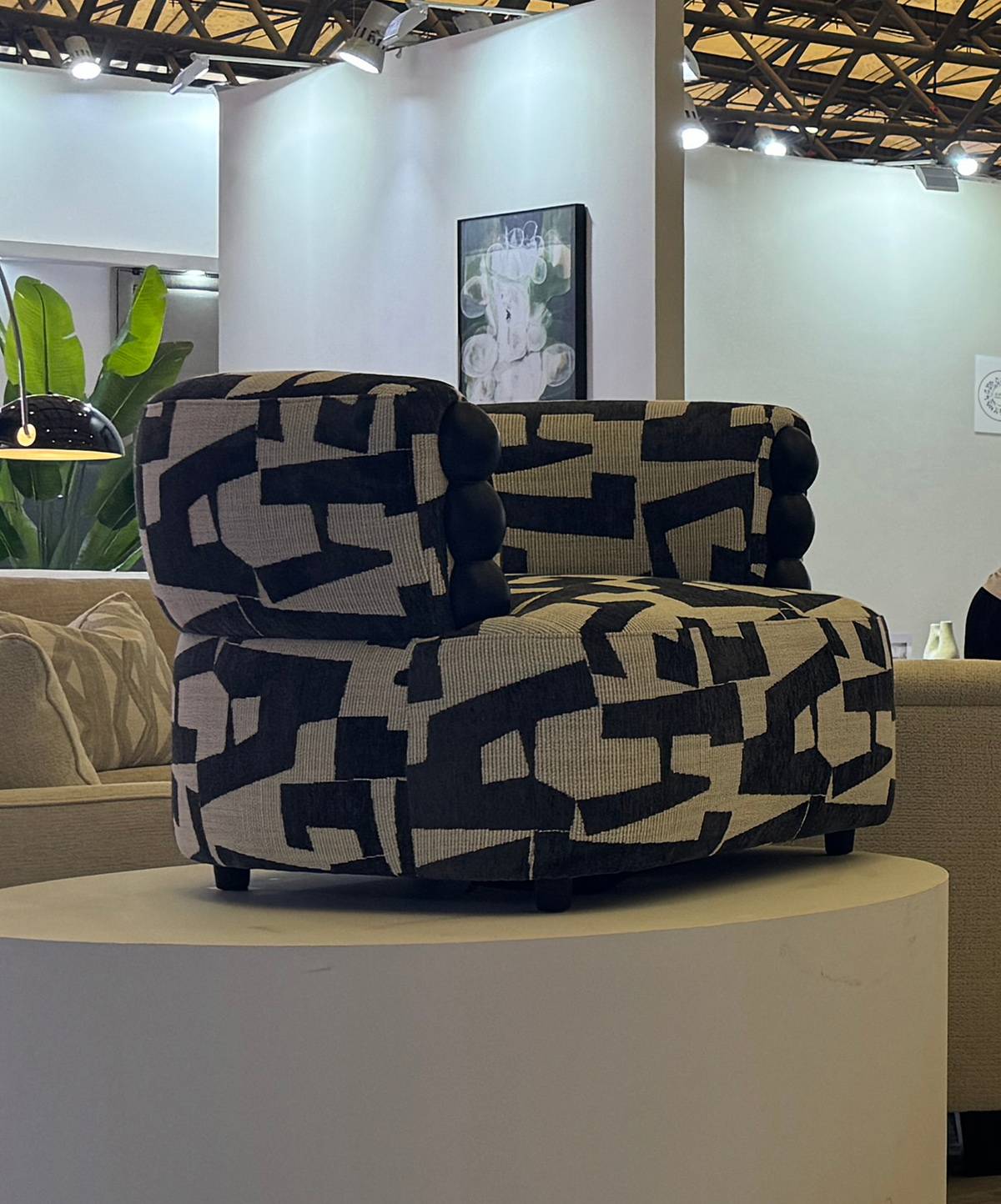 Side view of the black and white geometric patterned lounge chair