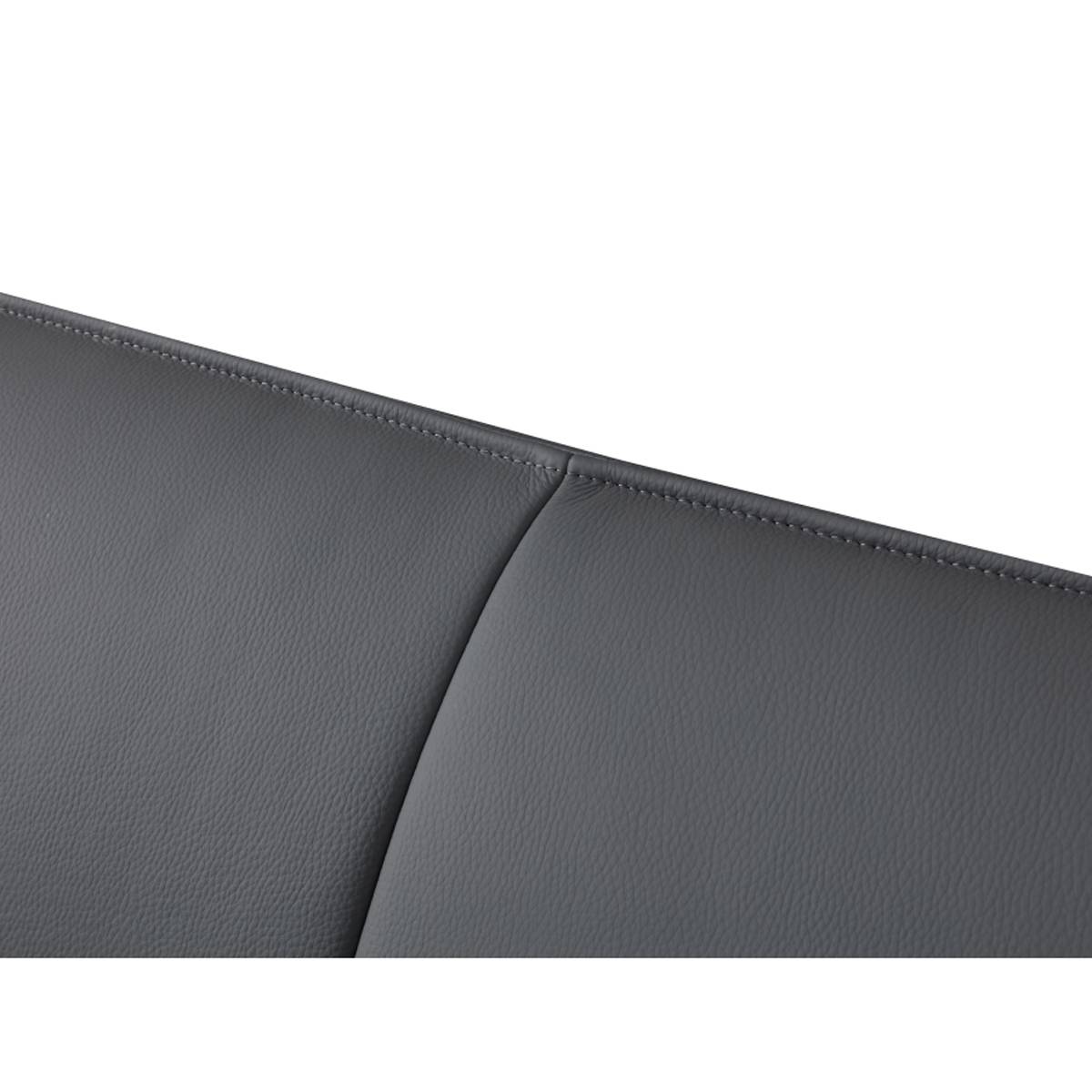 Detail shot of the leather texture and stitching on the headboard