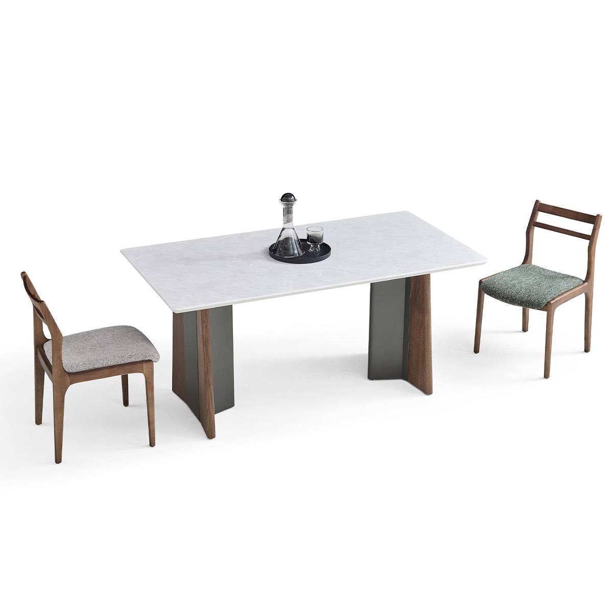 Angled view of the dining table with two wooden chairs