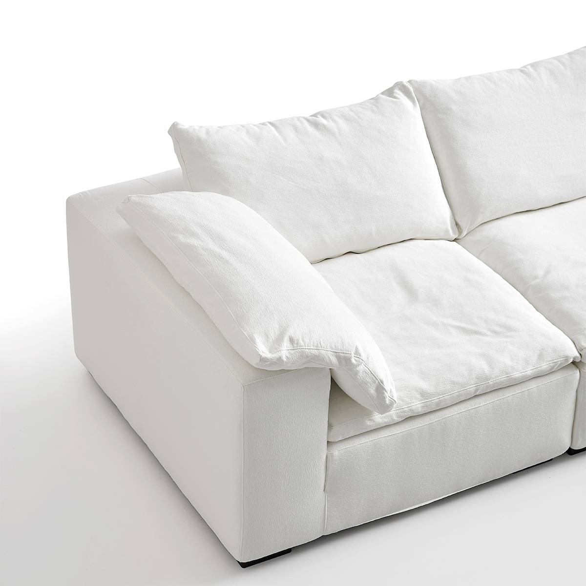 Close-up of the sofa armrest and side cushion detail