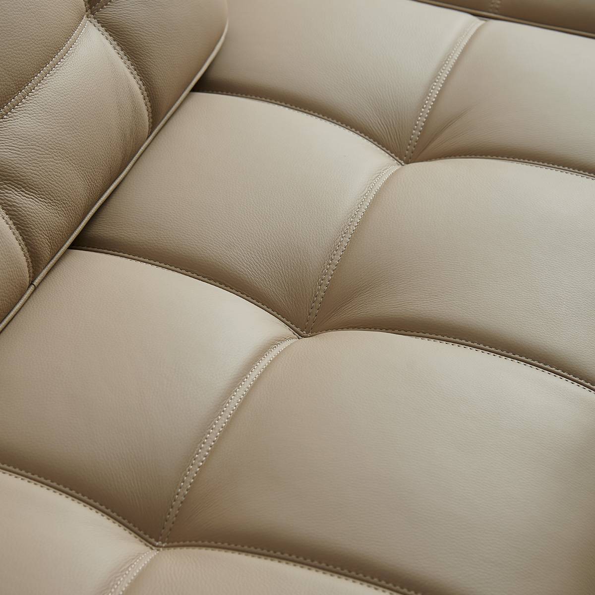 Detail view of leather texture and stitching on Lawrence sofa