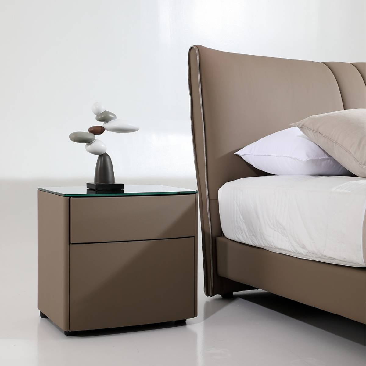 Close-up of the bedside table and the side of the bed headboard