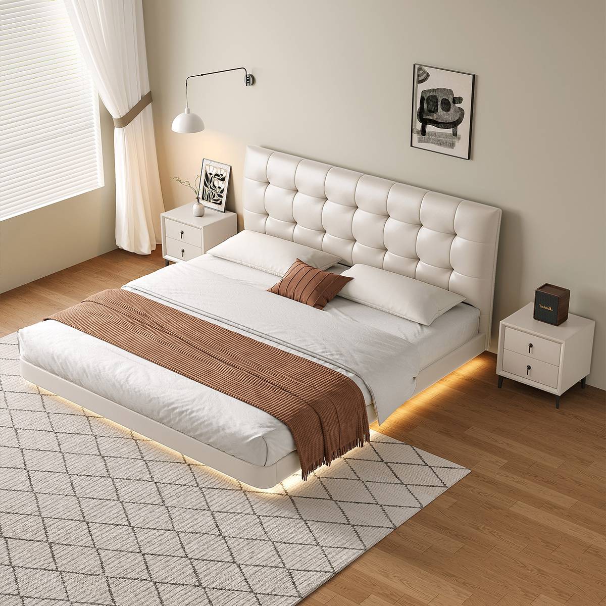 High angle view of the white tufted bed with ambient lighting underneath