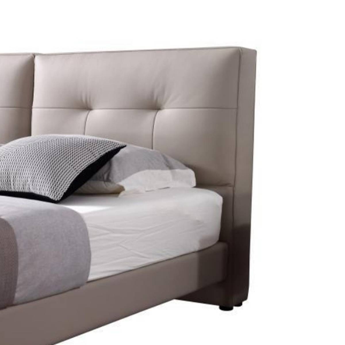 Close-up detail of the tufted leather headboard and mattress