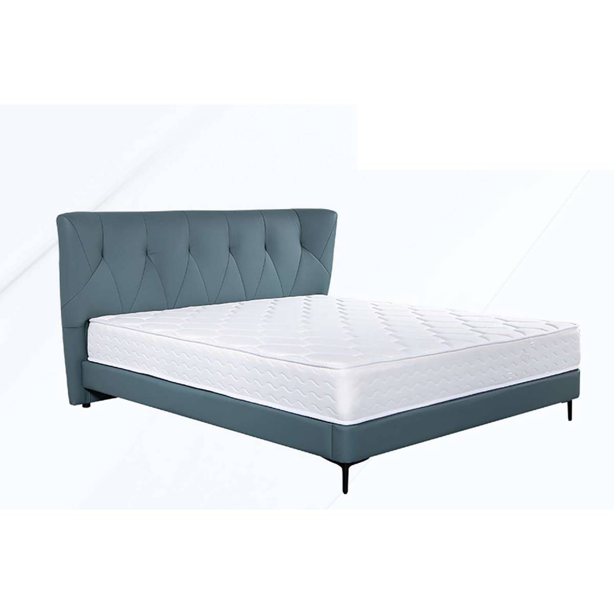 Grey tufted leather bed frame with white mattress on a white background