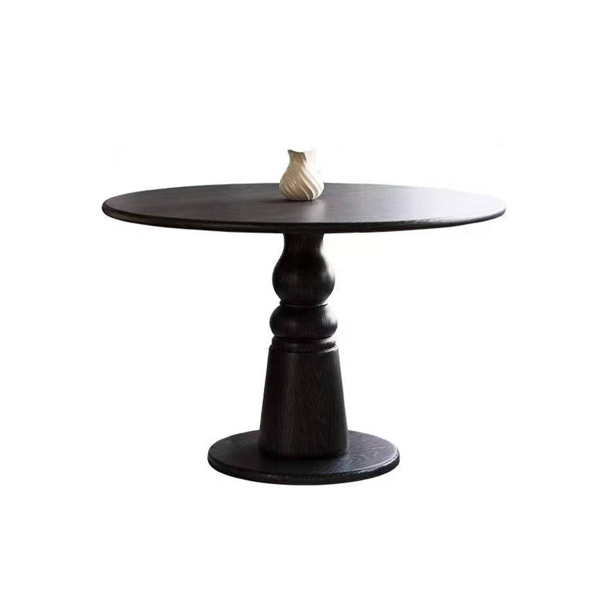 Side view of the black round dining table
