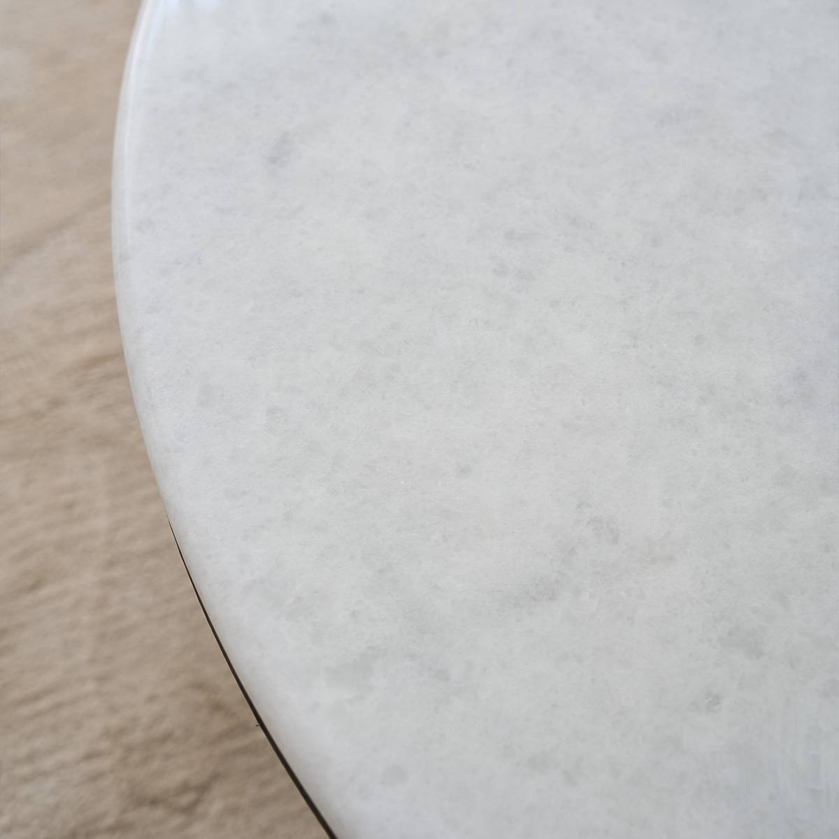 Close-up detail of the white marble or stone surface texture.