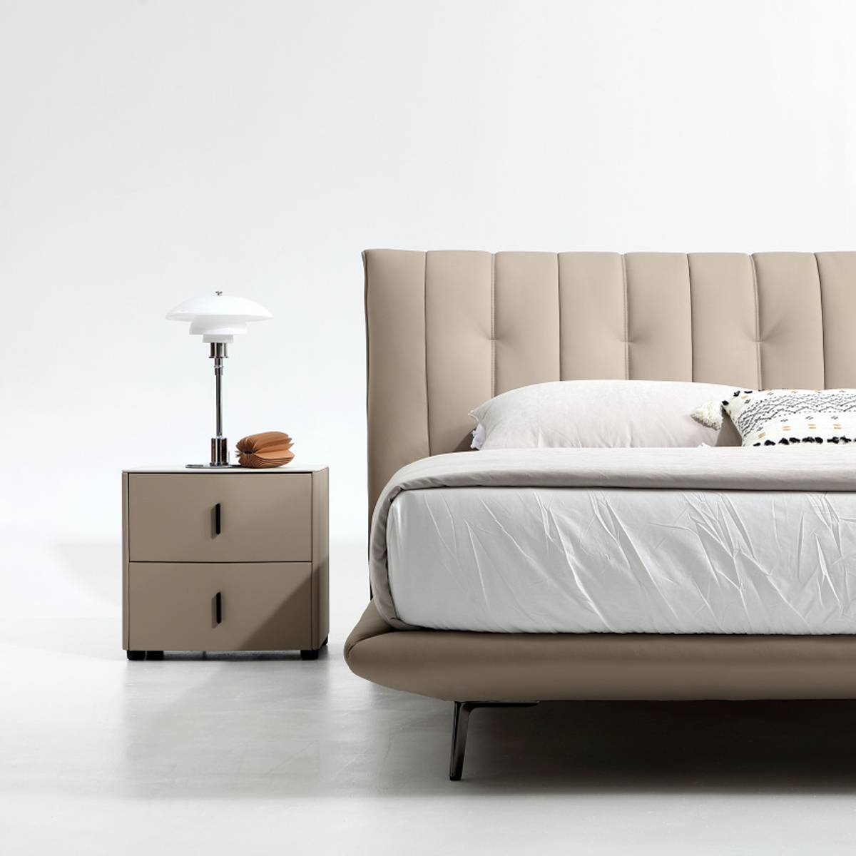 Close-up detail of the bed frame leg and bedside table