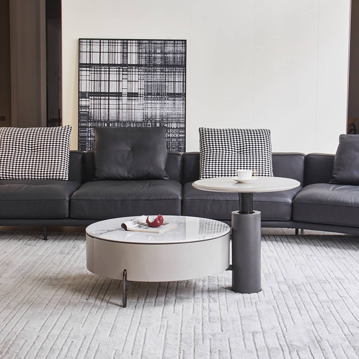 Front view of the coffee table set in a living room setting with abstract art