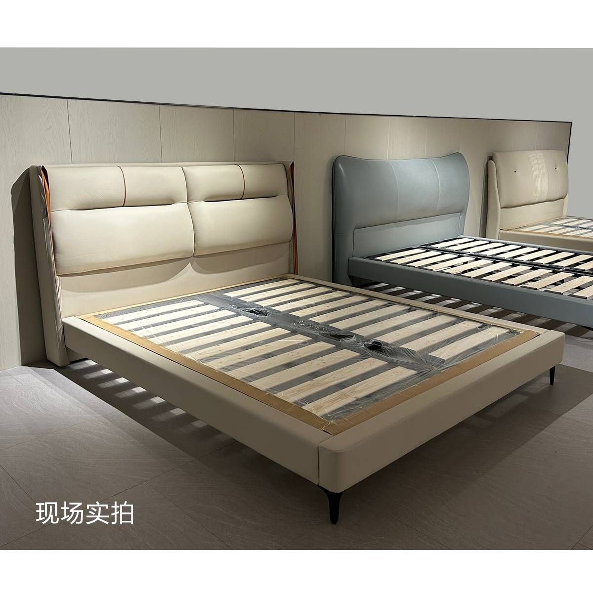 Real shot of the bed frame showing the wooden slat base structure
