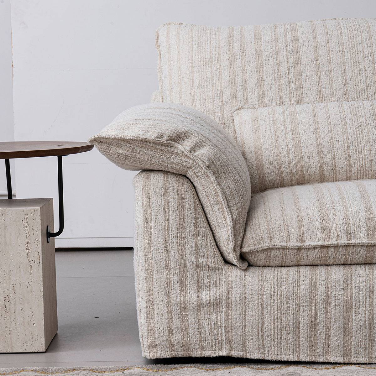 Close-up detail of the sofa arm and fabric texture