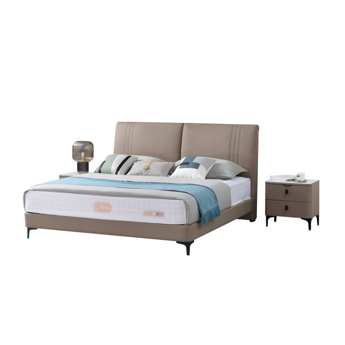 Full view of the taupe leather bed with bedding and bedside table