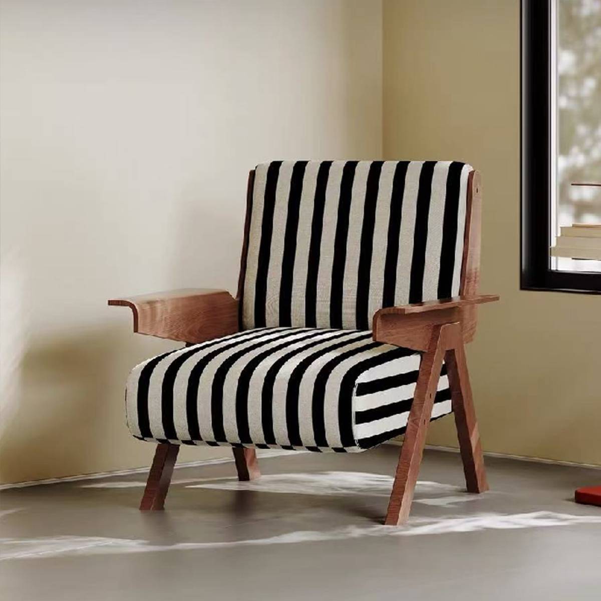 Side view of a lounge chair with a wooden frame and black and white striped fabric upholstery