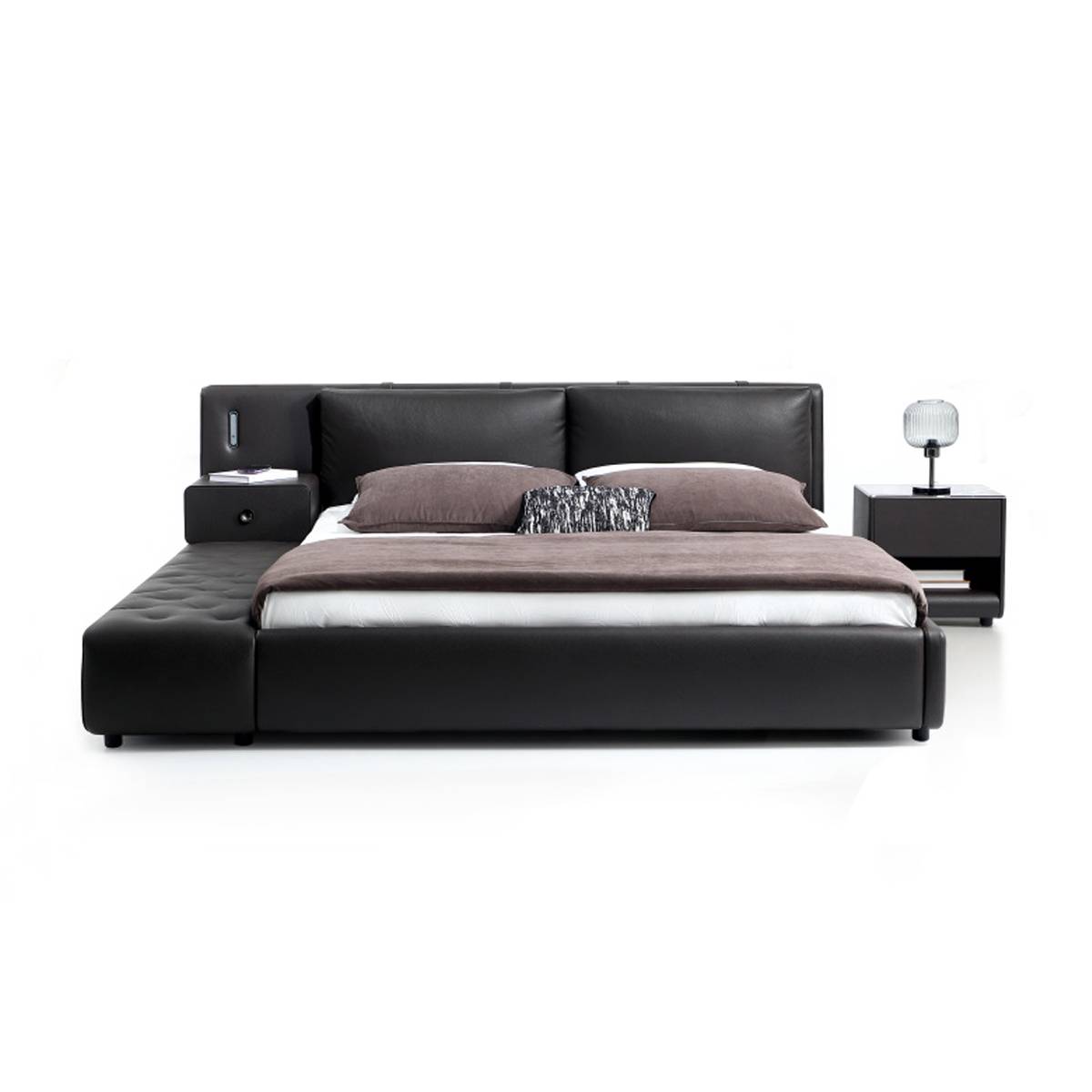 Front view of the black leather bed with pillows and throw blanket