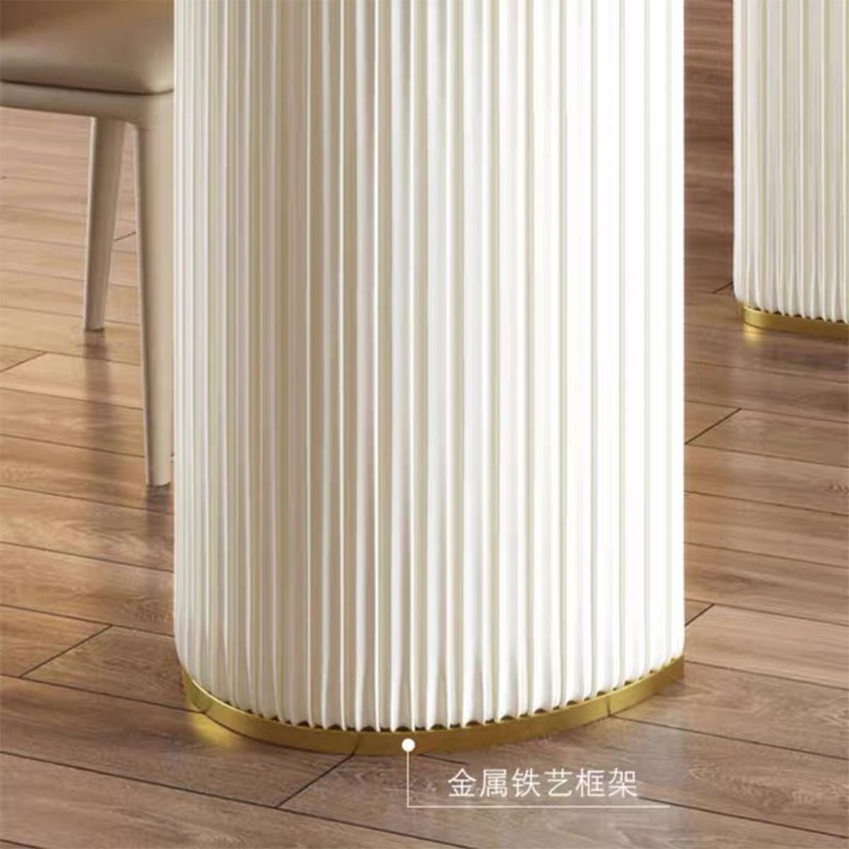 Close-up of the dining table base showing the metal iron art frame and pleated design