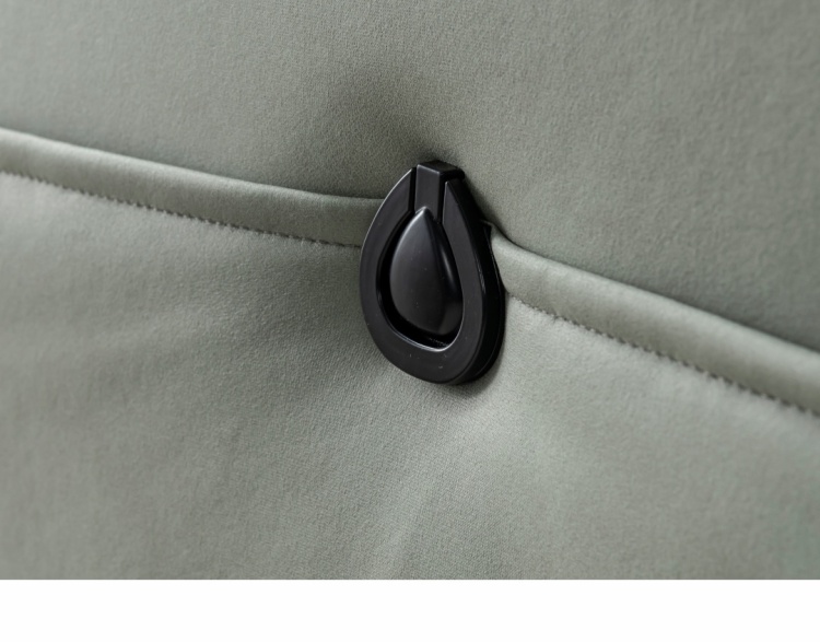 Close-up of the black toggle detail on the sofa armrest.