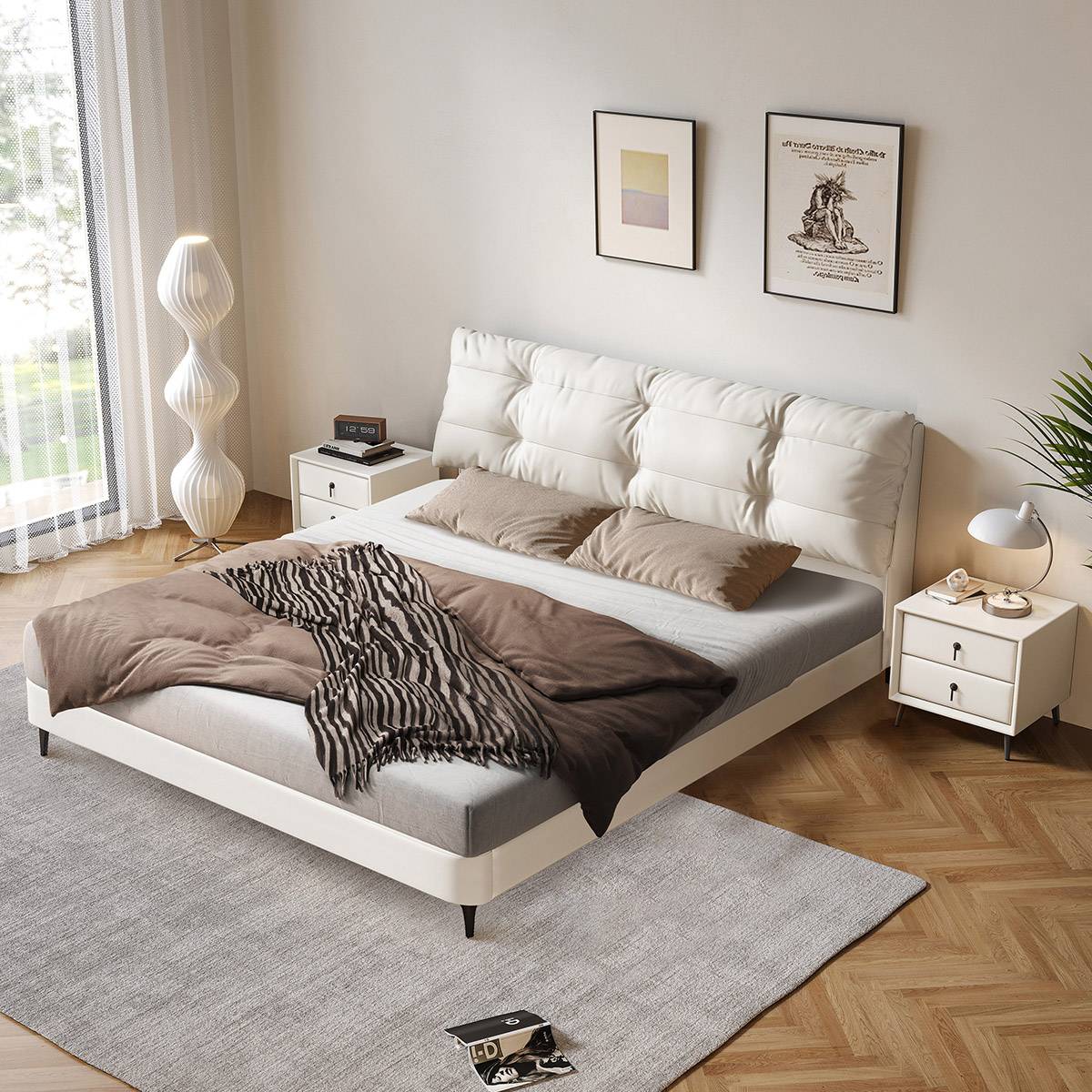 Bed made up with grey mattress, brown duvet, and zebra print throw.