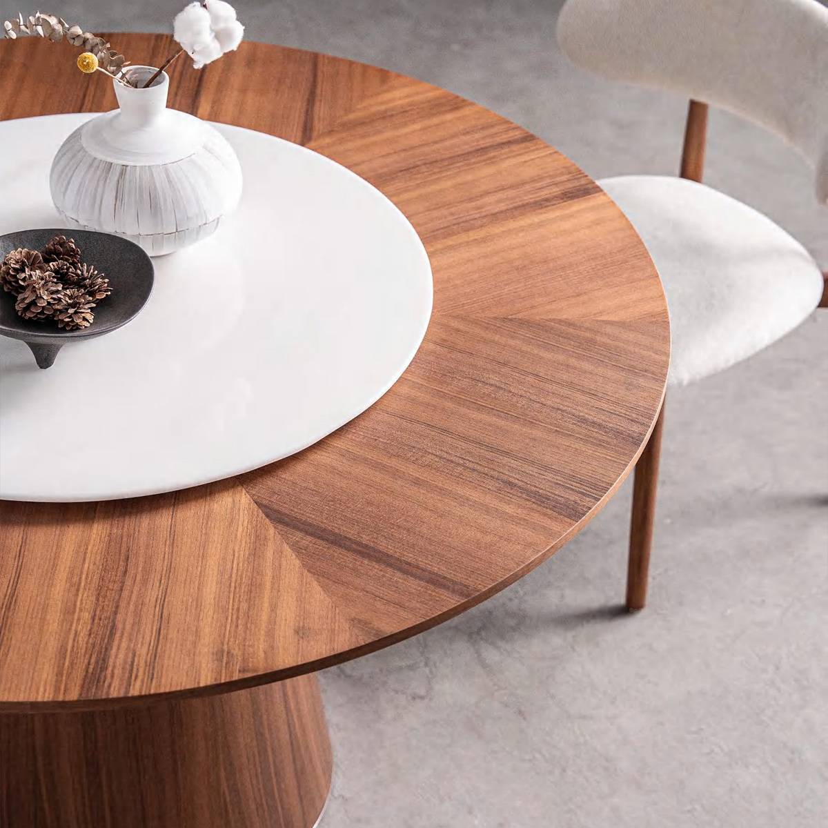 Close-up detail of the table surface showing the wood grain and stone insert