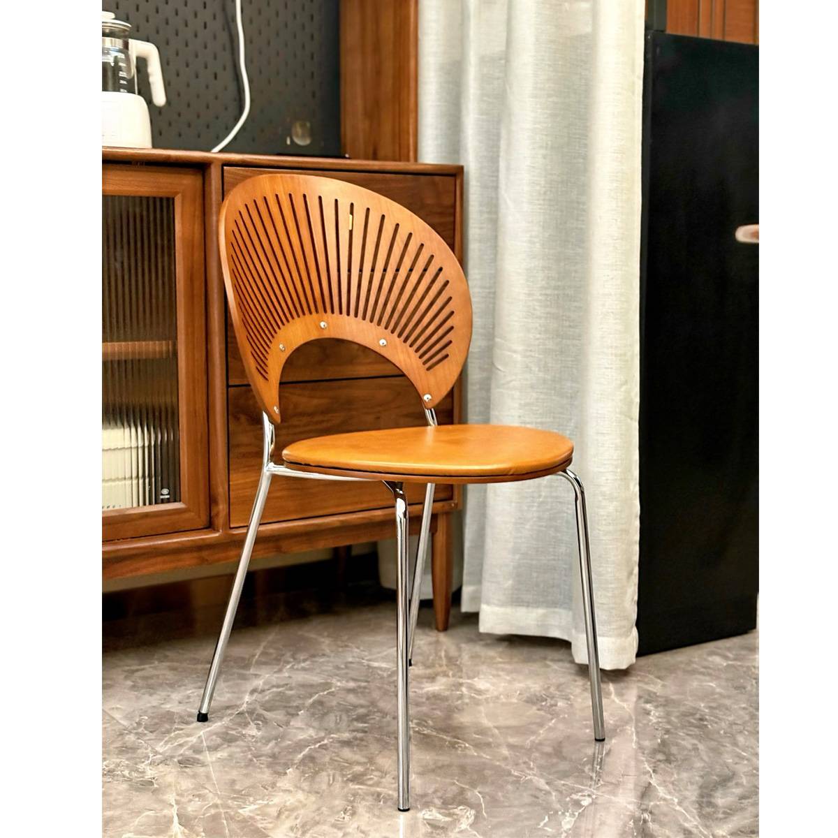 Yellow upholstered shell dining chair in a living room setting