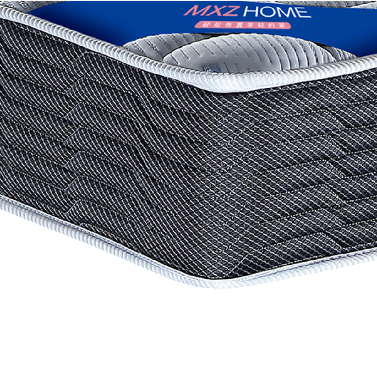 Close-up of the mattress corner showing the MXZ HOME label and fabric weave