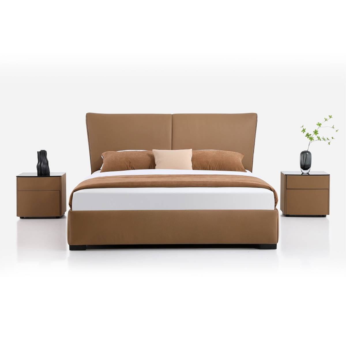 Front view of the brown leather bed showing the headboard and bedding arrangement