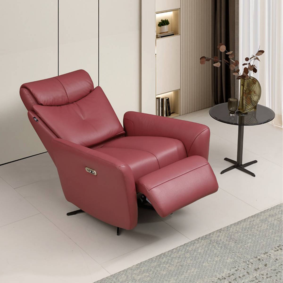 Pink genuine leather electric recliner chair in reclined position with footrest extended