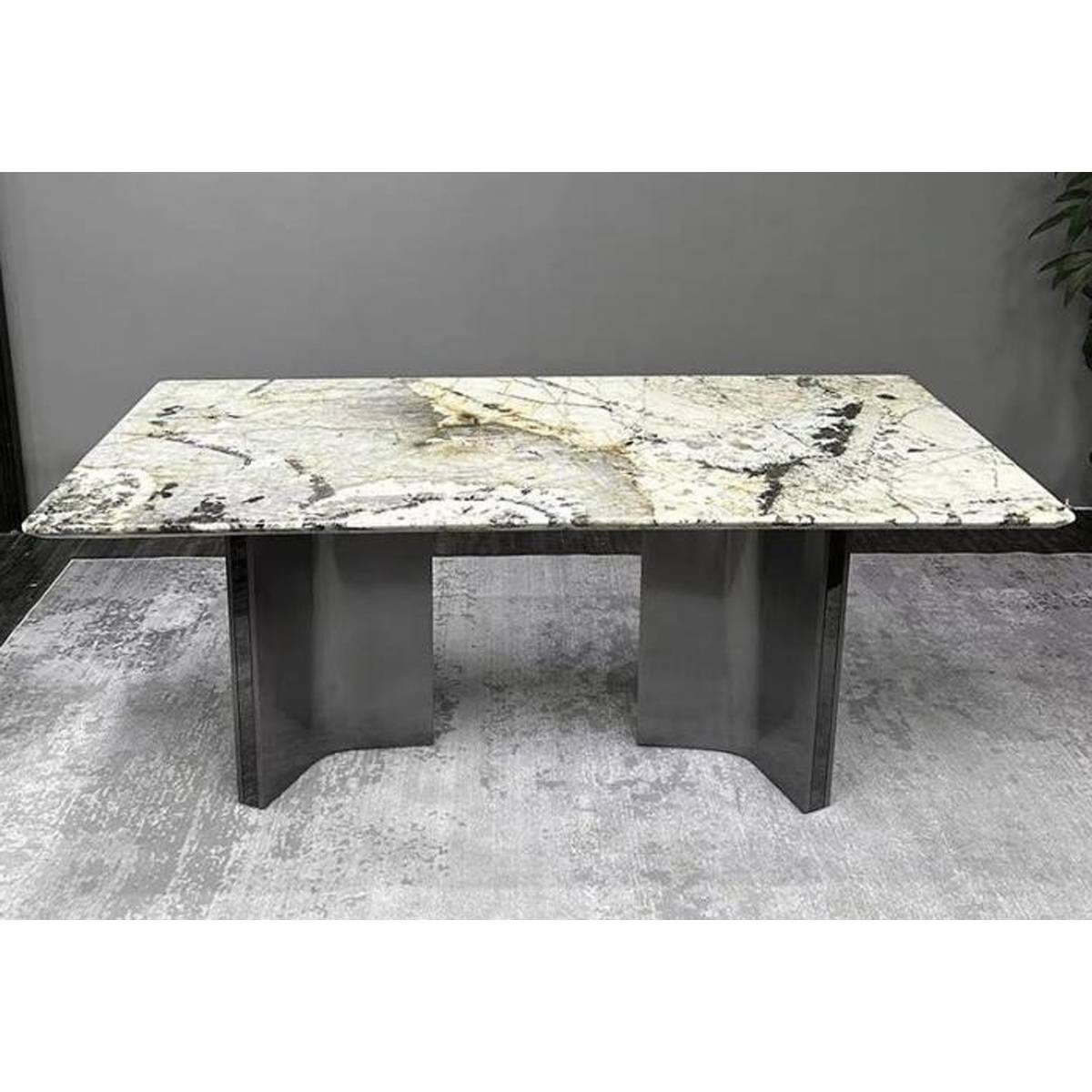 Front view of the dining table highlighting the base structure and stone surface