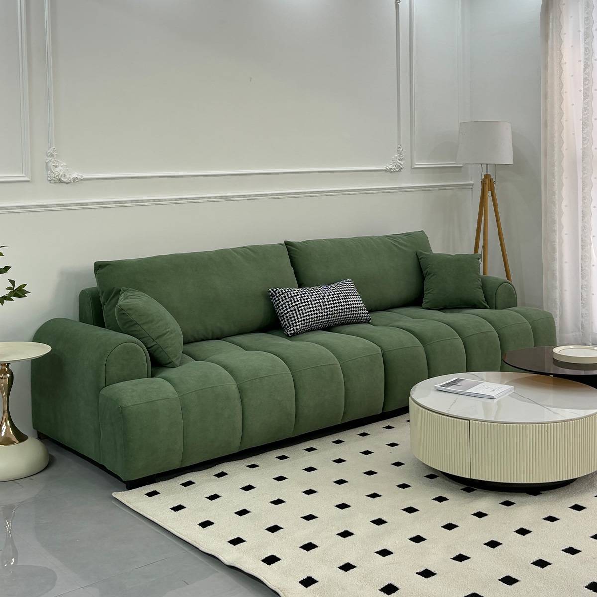 Green tufted straight sofa with matching cushions