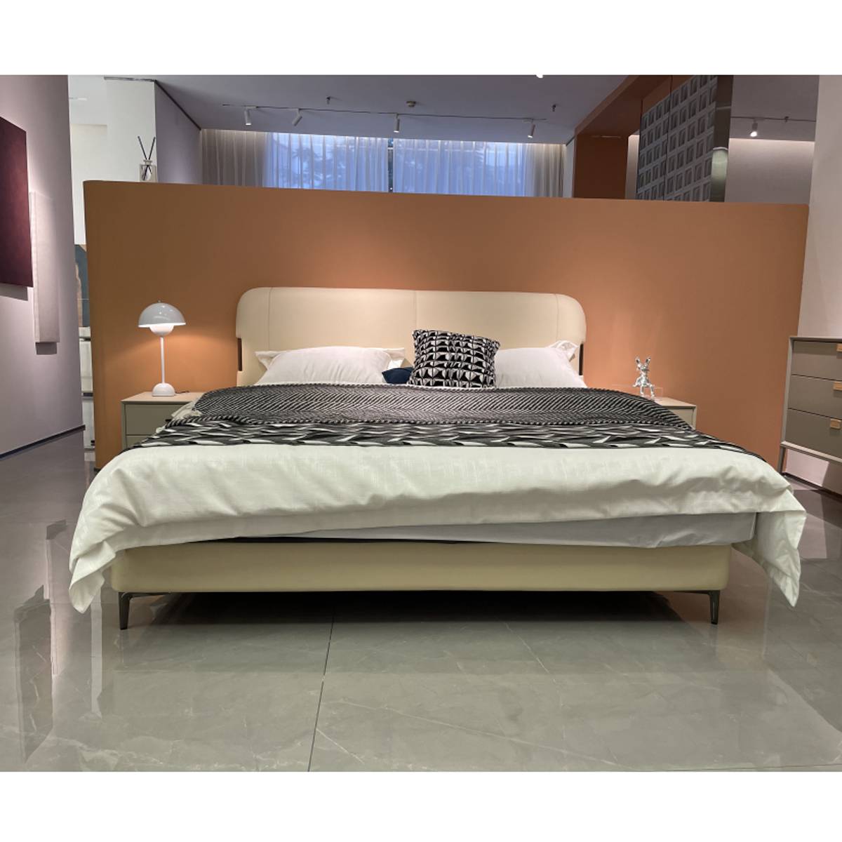 Front view of the bed highlighting the low profile and legs
