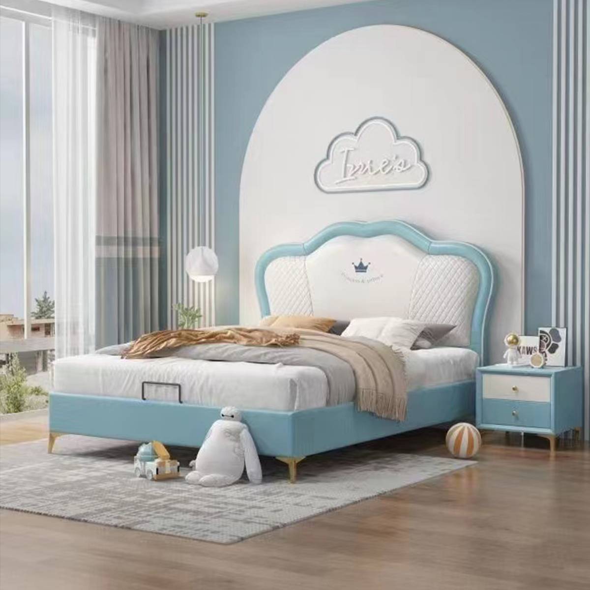 Blue and white upholstered children's bed with quilted headboard
