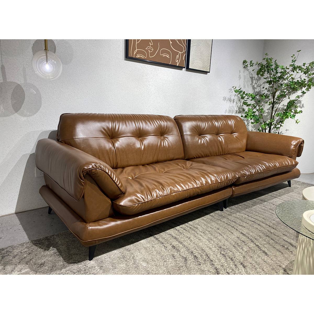 Side angle view of brown leather sofa